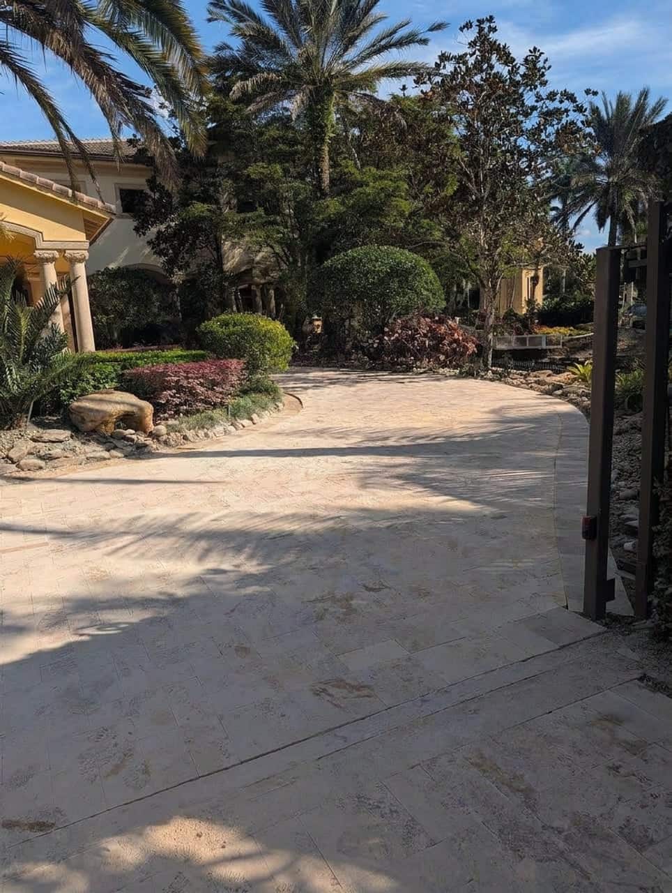 Travertine paver driveway installation in Miami