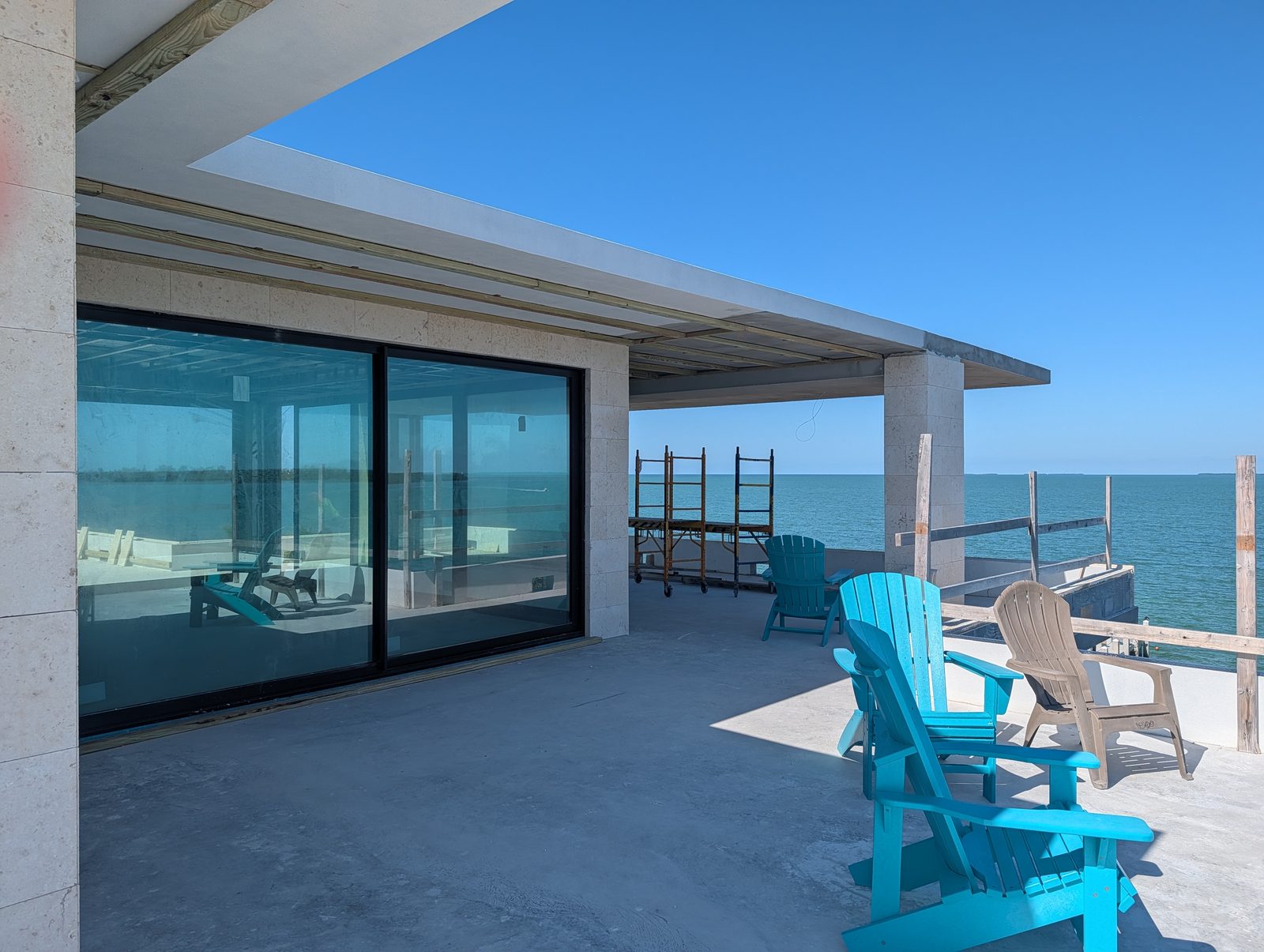 Coral stone pool deck on a 50,000 sq ft Islamorada, FL estate by Driveway & Paver Solutions