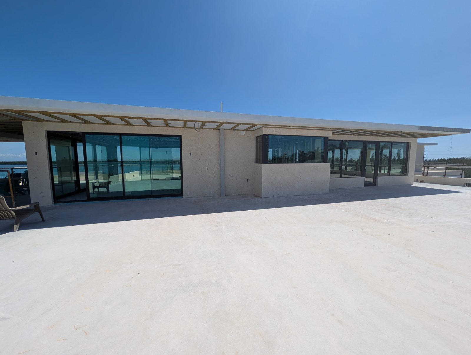 Coral stone pool deck on a 50,000 sq ft Islamorada, FL estate by Driveway & Paver Solutions