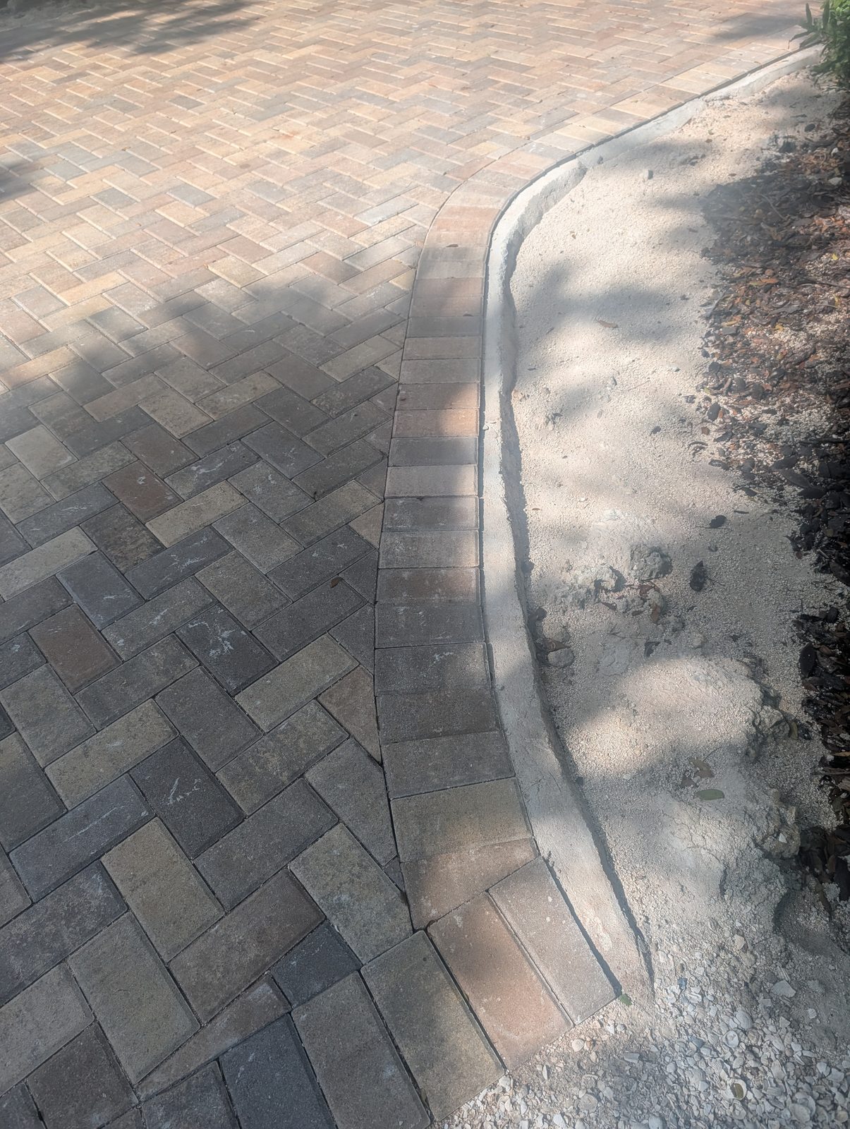 Coral stone walkway pavers on a 50,000 sq ft Islamorada, FL estate by Driveway & Paver Solutions