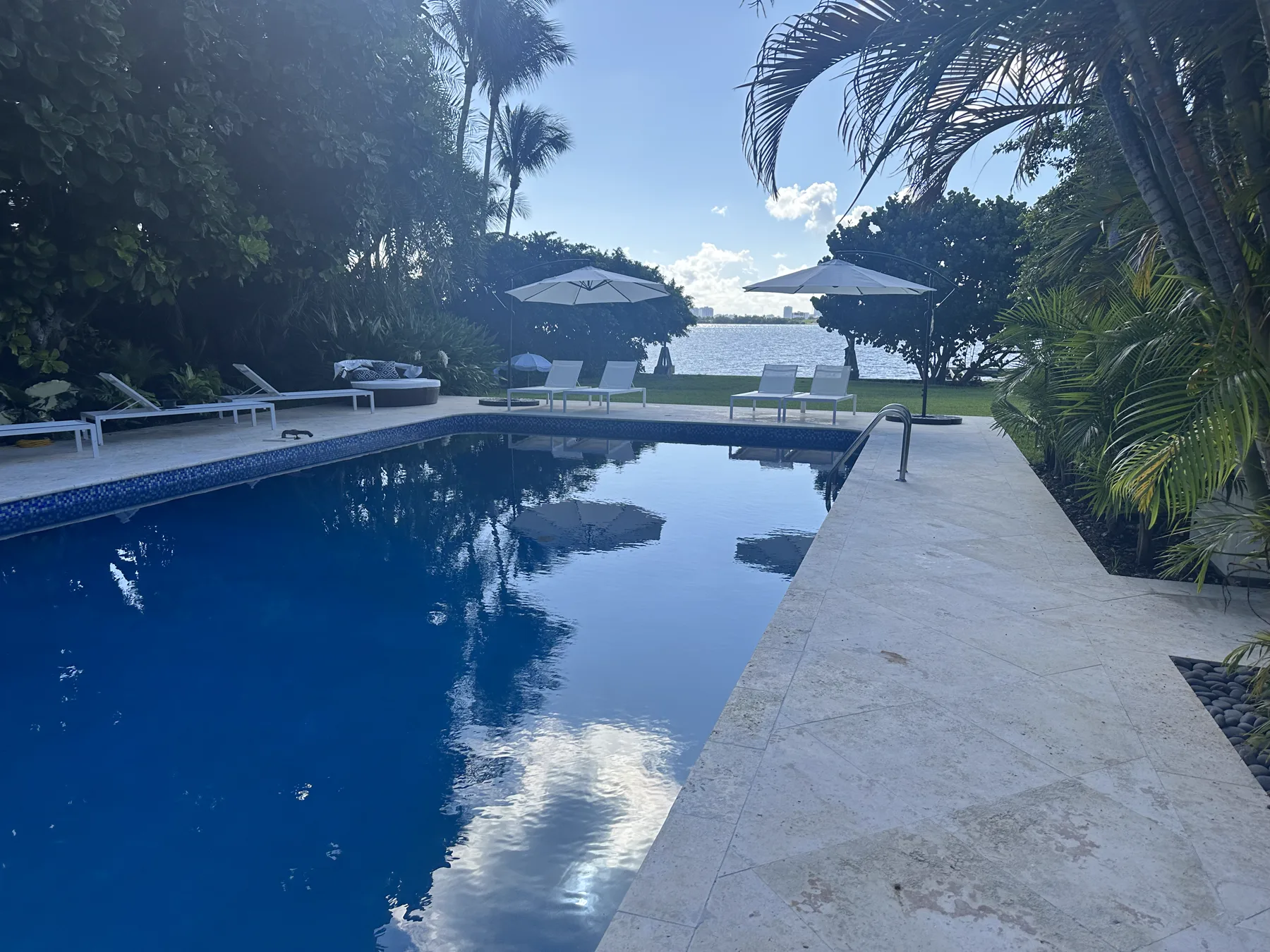 Finished 2,200 sq ft coral stone pool deck overlooking the water in Miami Beach