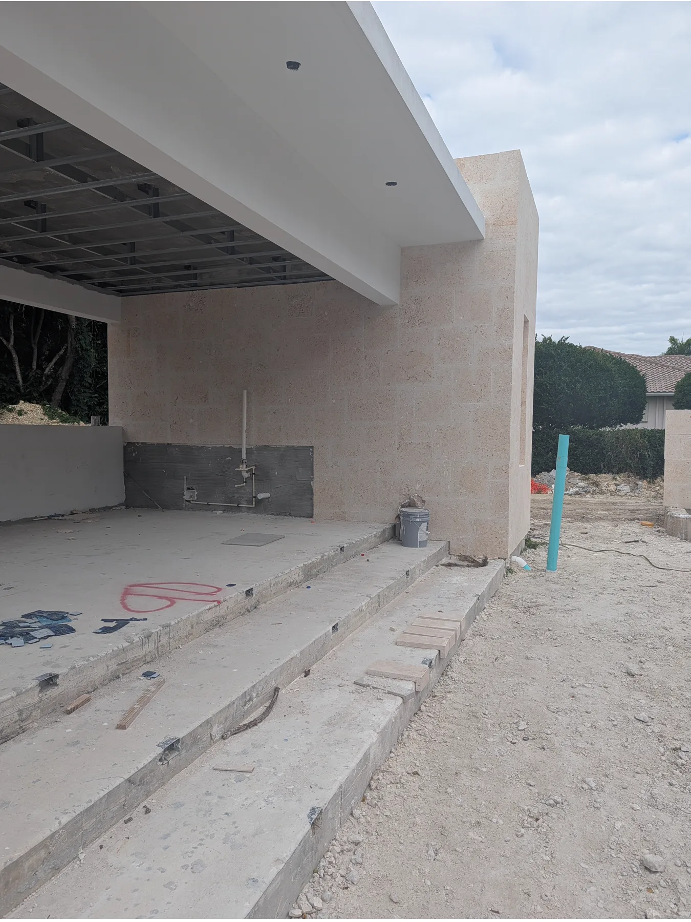 Coral stone cladding inside a covered patio at a Pinecrest residence