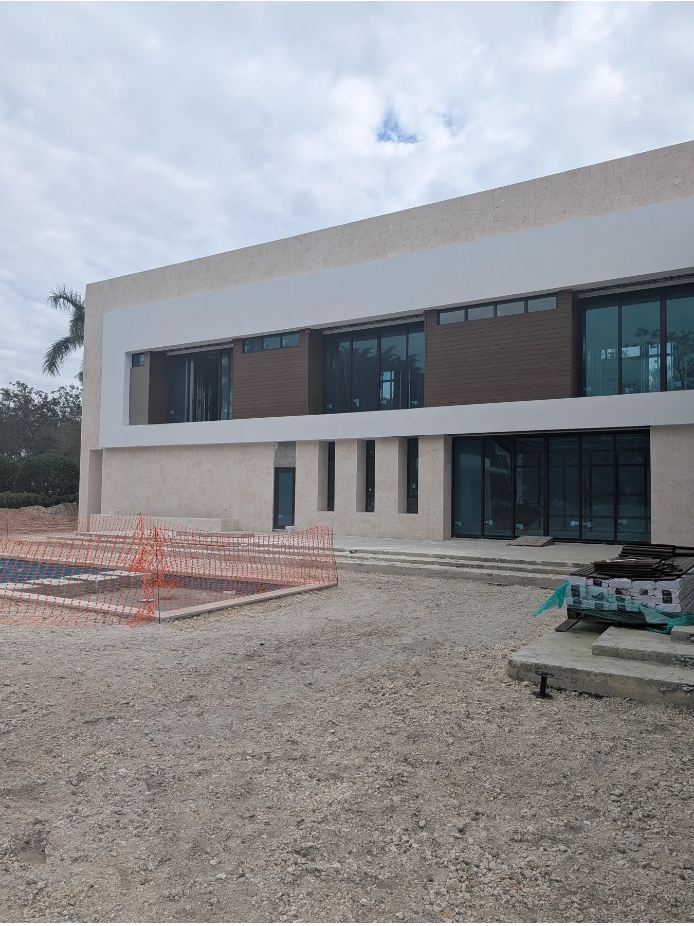 Approximately 6,000 sq ft coral stone cladding installation on a Pinecrest residence