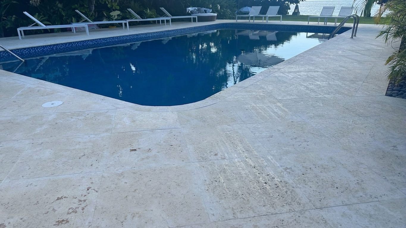 Waterfront pool deck remodel with natural stone
