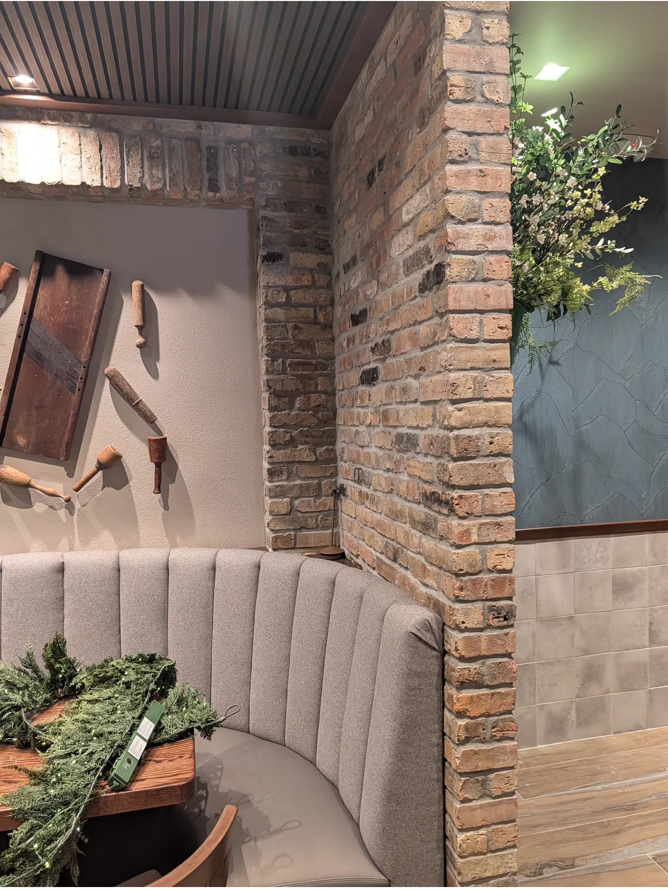 Old Chicago brick walls surrounding a banquette at Sergio’s Restaurant