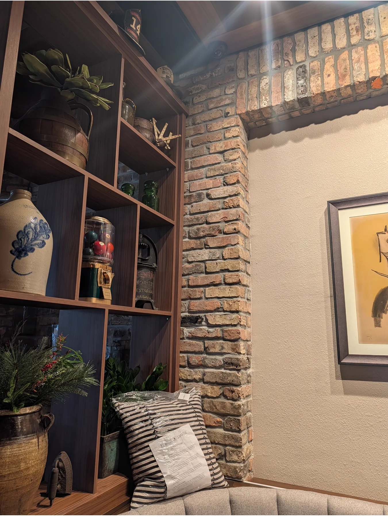 Old Chicago brick framing an interior display nook at Sergio’s