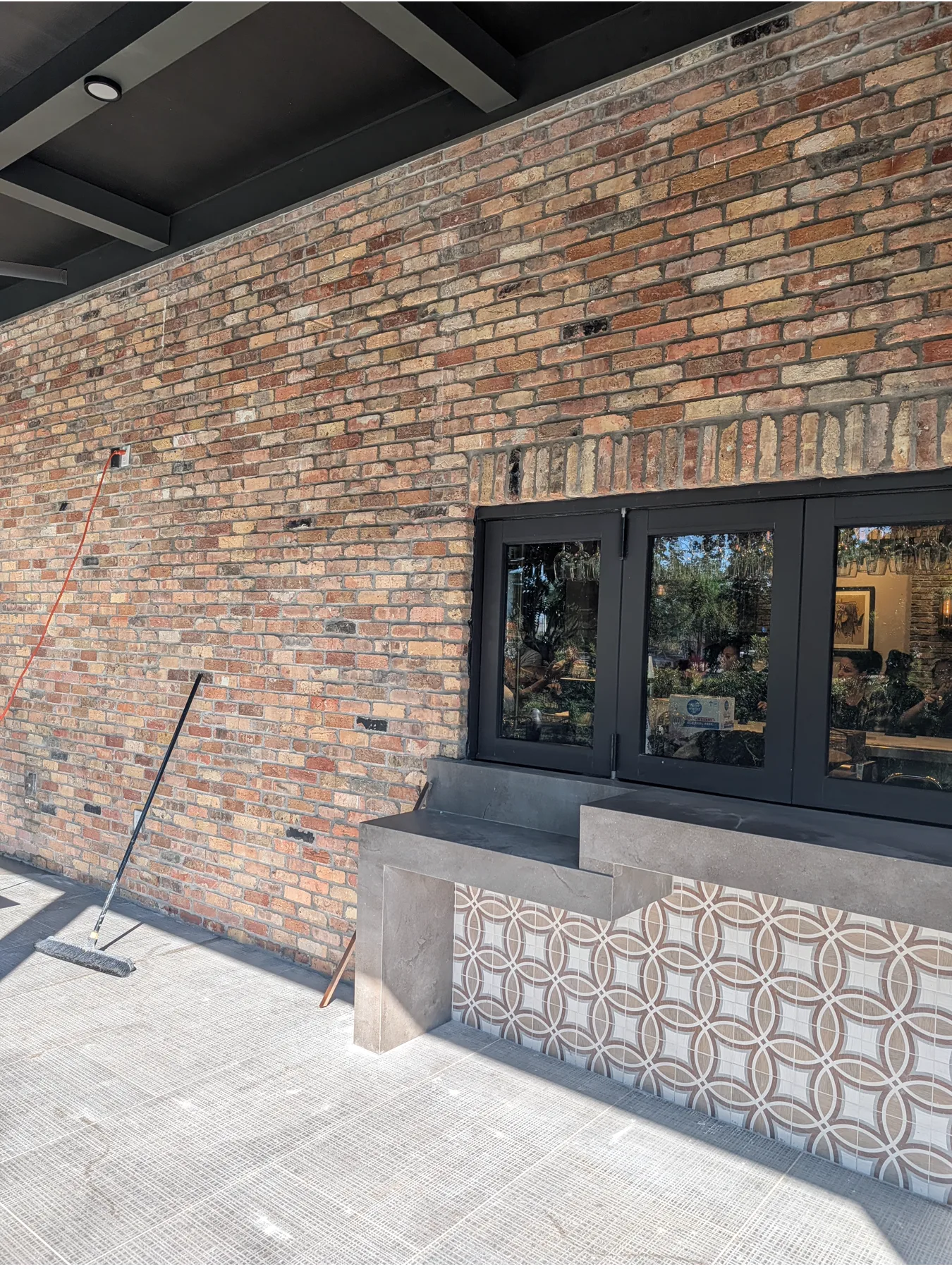 Old Chicago brick wall and service opening on the restaurant patio