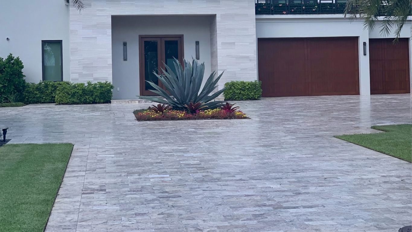 Silver travertine driveway installed in Miami