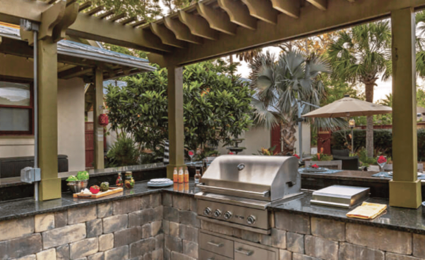 Stylish outdoor kitchen on durable concrete pavers.