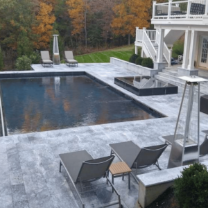 Above-ground pool with a natural stone deck