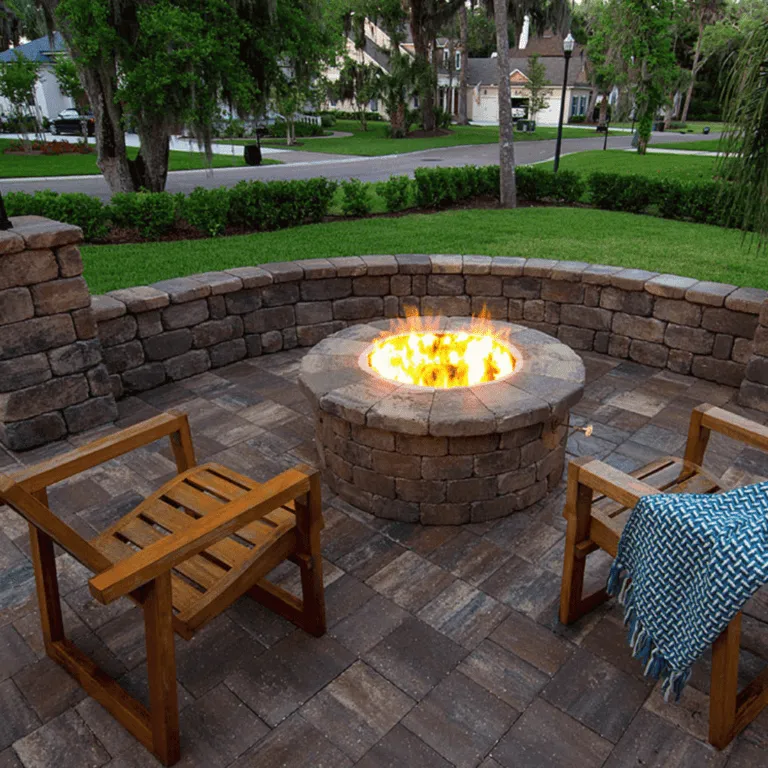 Patio featuring a fire pit built with concrete pavers by Larrauris Constructions.