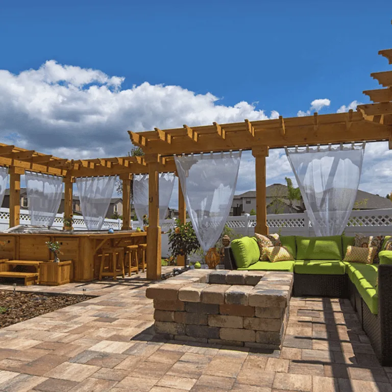 Patio featuring a fire pit built with concrete pavers by Larrauris Constructions.