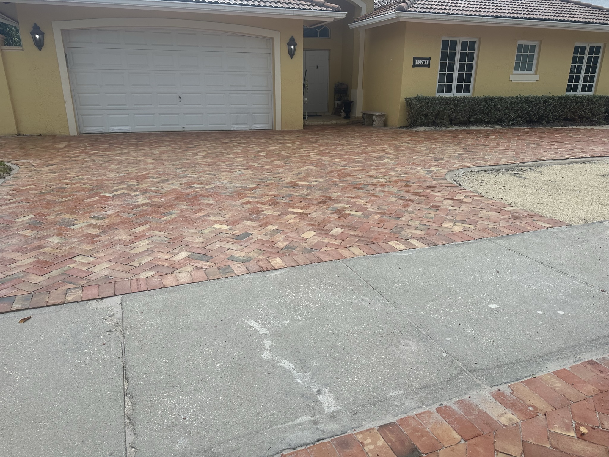 Completed Chicago brick driveway project in a suburban setting.