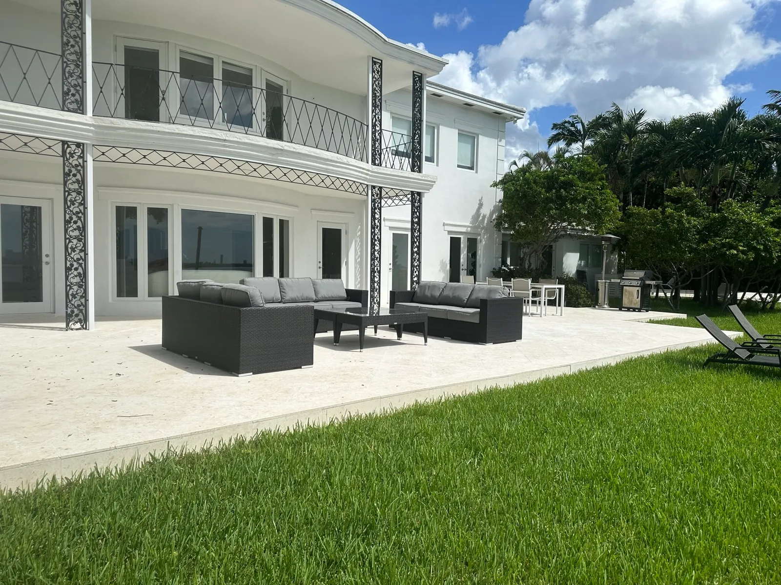 Travertine patio with fire pit feature Homestead FL
