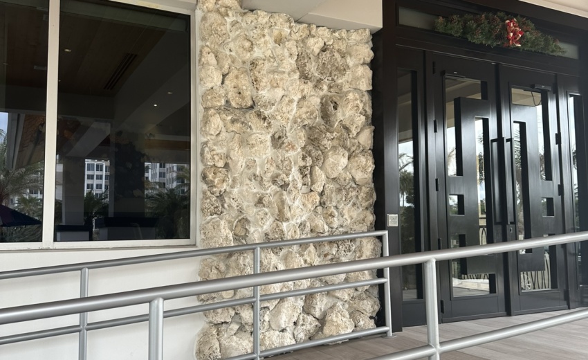 Masterfully constructed stone wall by Driveway & Paver Solutions at Delray Beach Club, reflecting unmatched craftsmanship.