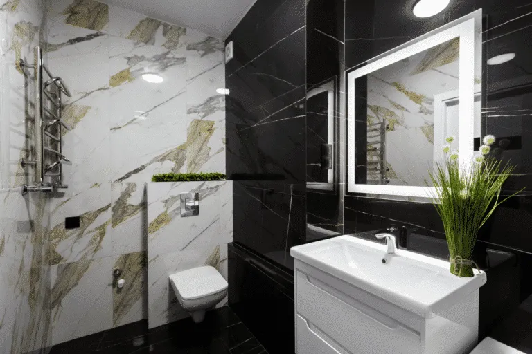 Luxurious modern bathroom design with black marble-look wall and floor tiles, white marble accent wall, and contemporary sink vanity for high-end bathroom renovations in NYC and 30 miles radius.