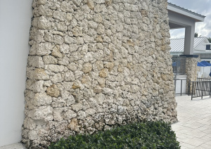 Stunning stone wall crafted by Driveway & Paver Solutions at Delray Beach Club, epitomizing elegance and durability.